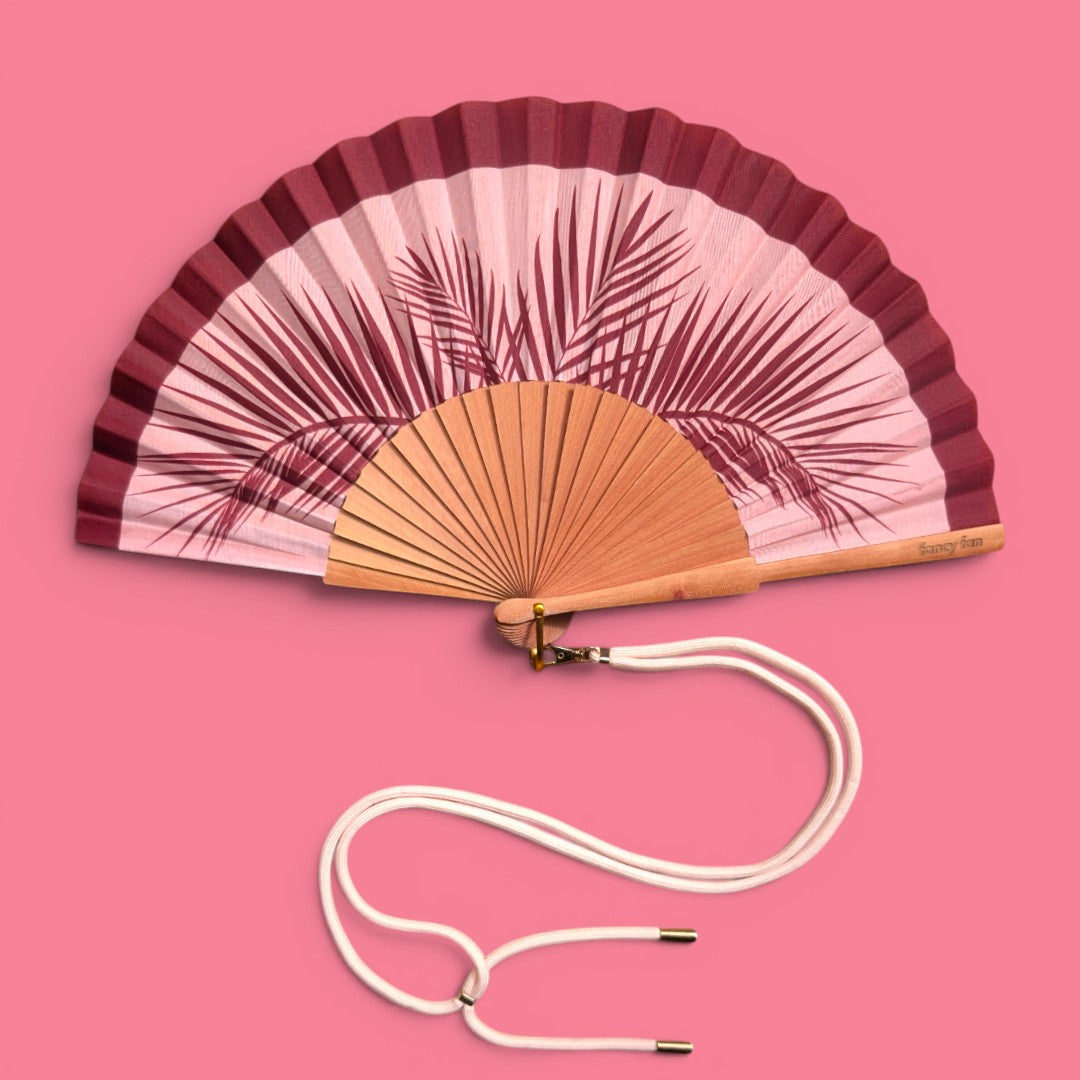 LE BAZAR INOUI Faltfächer aus Holz und Stoff mit Palmenblatt-Print in Rot und Rosa inklusive Trageband