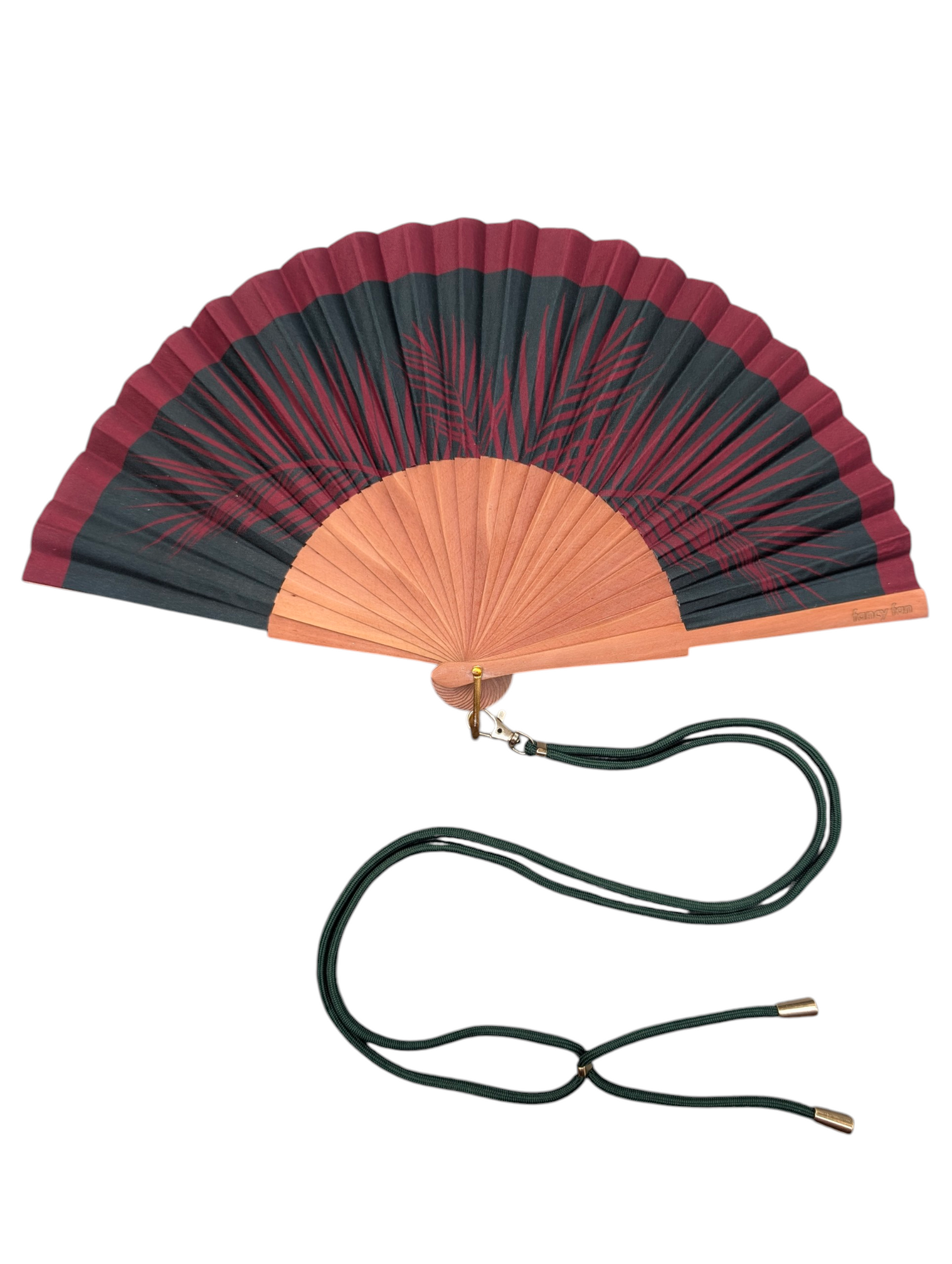 LE BAZAR INOUI PALM LEAFS Handfächer aus Holz und Stoff mit dunkelrotem Palmenmuster und grünem Umhängeband.